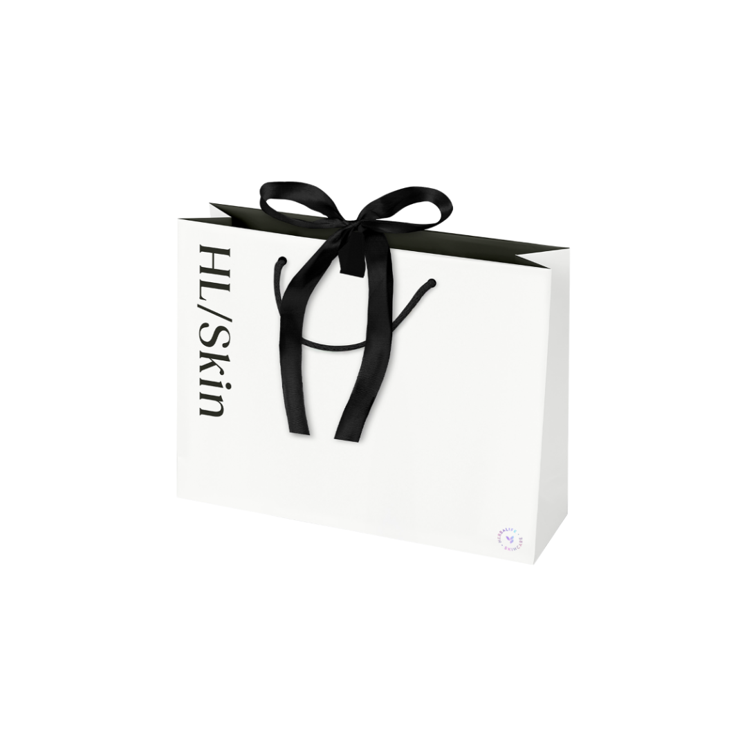 HL/Skin Premium Gifting Bag Small, white matte paper gift bag with black ribbon handles and HL/Skin logo